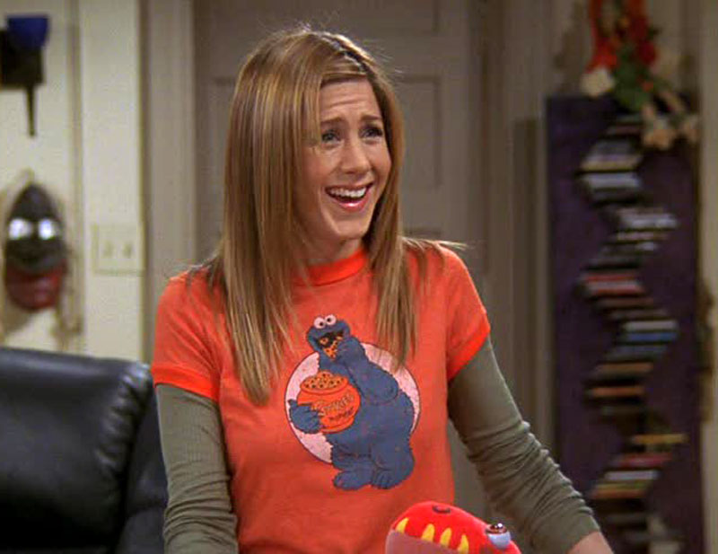 1990's -- T-Shirts Over Long-Sleeved Shirts. I would follow Rachel Green if she jumped off a bridge but this I cannot find the logic in or get behind at all. 